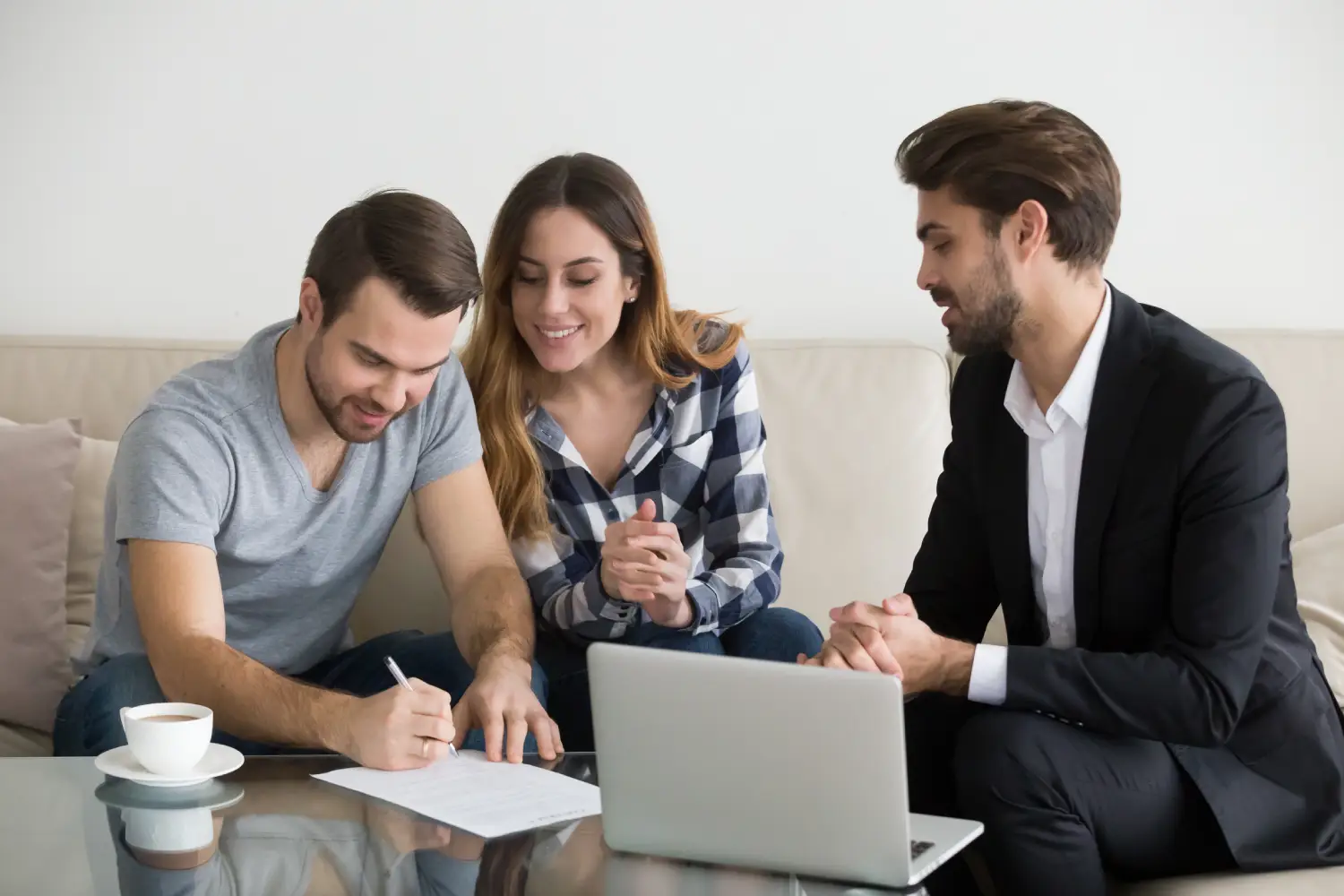 Property owner meeting with two tenants to discuss rental management services